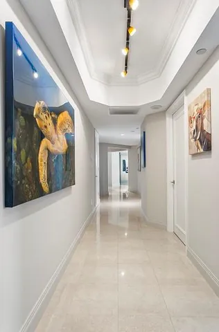 a spacious bathroom with a granite countertop sink and a mirror