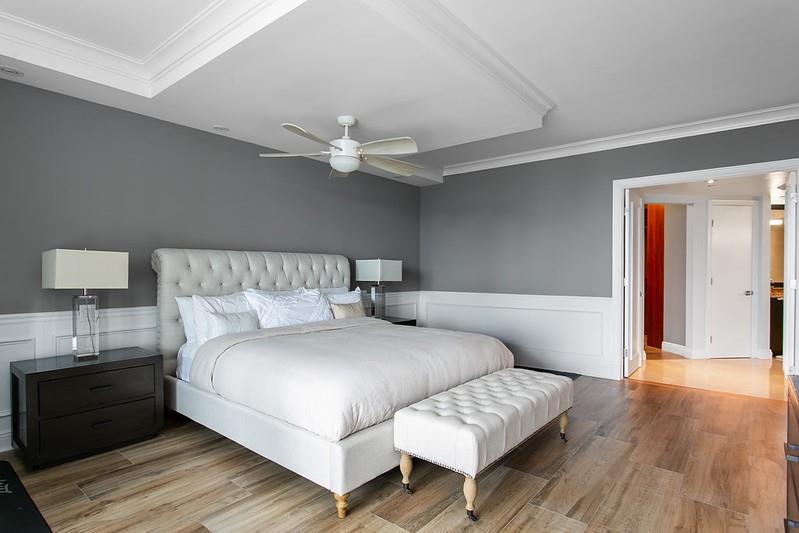 1700 South Ocean Boulevard, Unit 5B Lauderdale-by-the-Sea, FL 33062 - Photo 26 of 47 a bedroom with a bed and a night stand