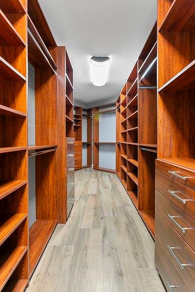 1700 South Ocean Boulevard, Unit 5B Lauderdale-by-the-Sea, FL 33062 - Photo 28 of 47 a view of walk in closet with clothes and shoes