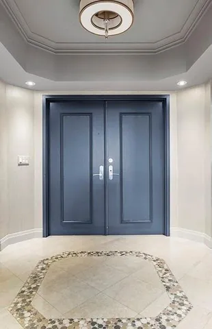 a view of a hallway with a wooden door