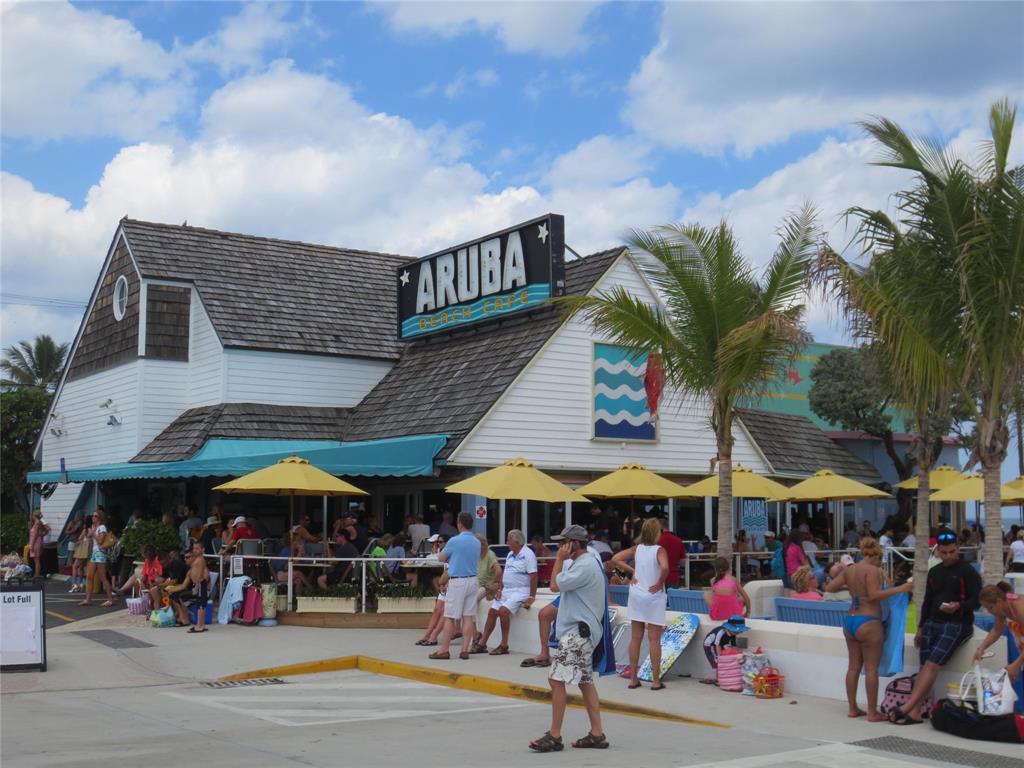 1700 South Ocean Boulevard, Unit 5B Lauderdale-by-the-Sea, FL 33062 - Photo 46 of 47 a view of street with lots of people and umbrellas