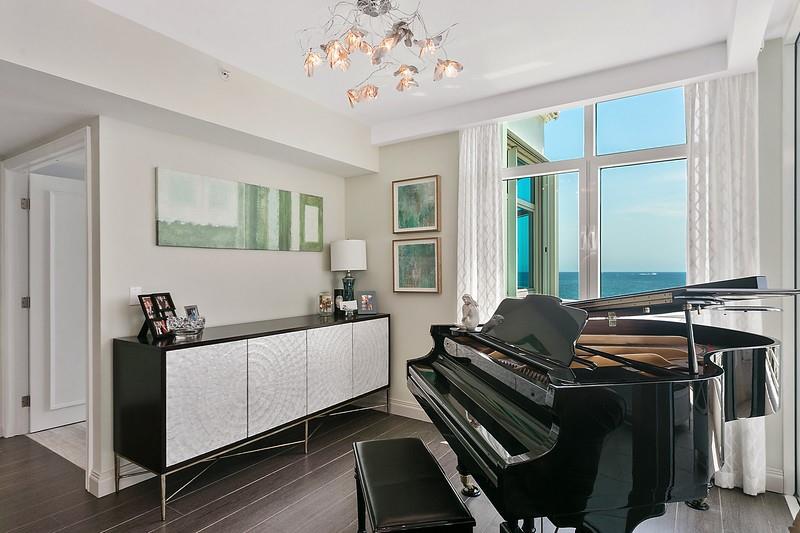 1700 South Ocean Boulevard, Unit 5B Lauderdale-by-the-Sea, FL 33062 - Photo 5 of 47 a living room with a bed furniture and a window