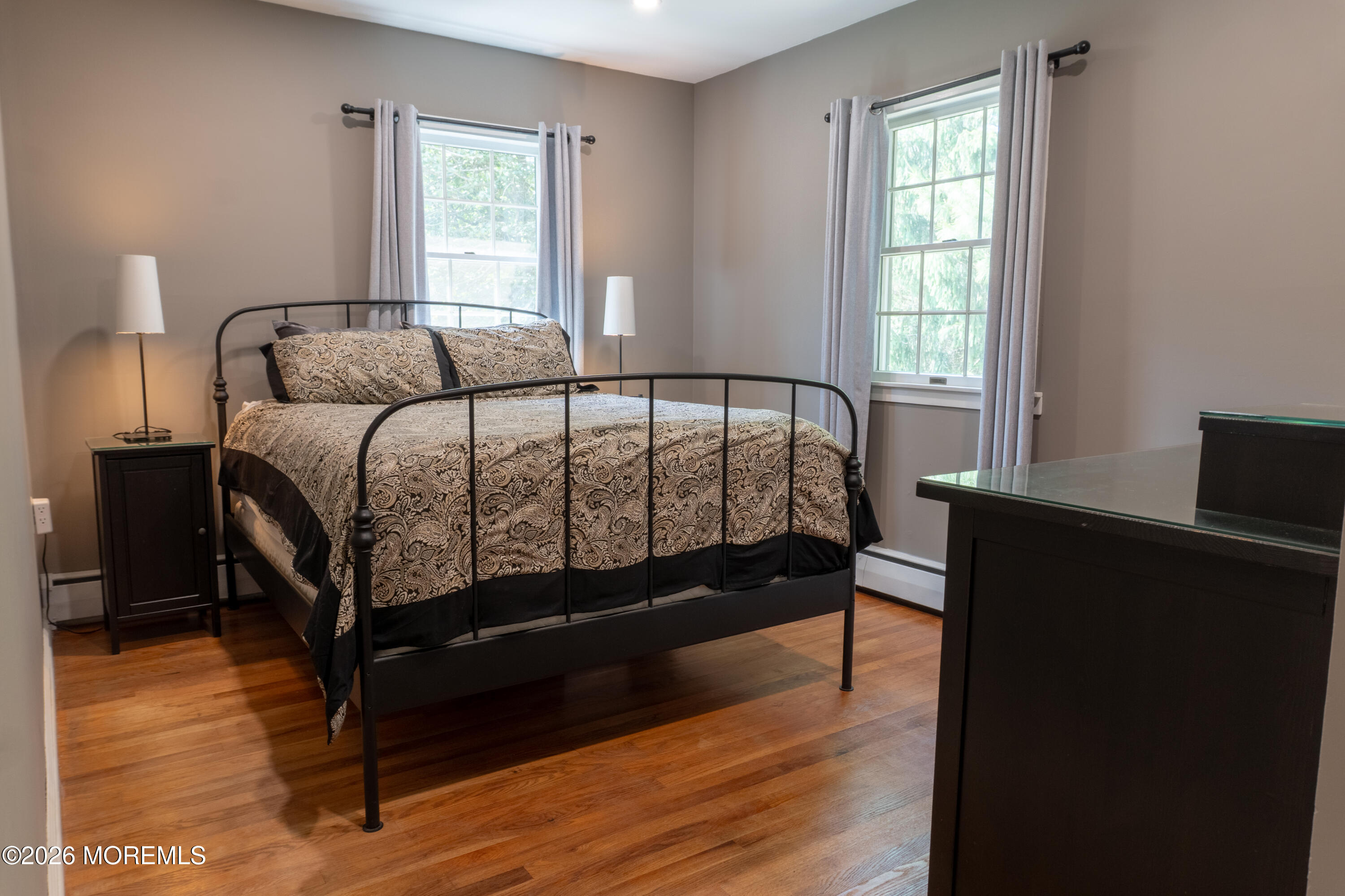 55 Toms River Road Jackson, NJ 08527 - Photo 8 of 31 a bedroom with a bed and wooden floor