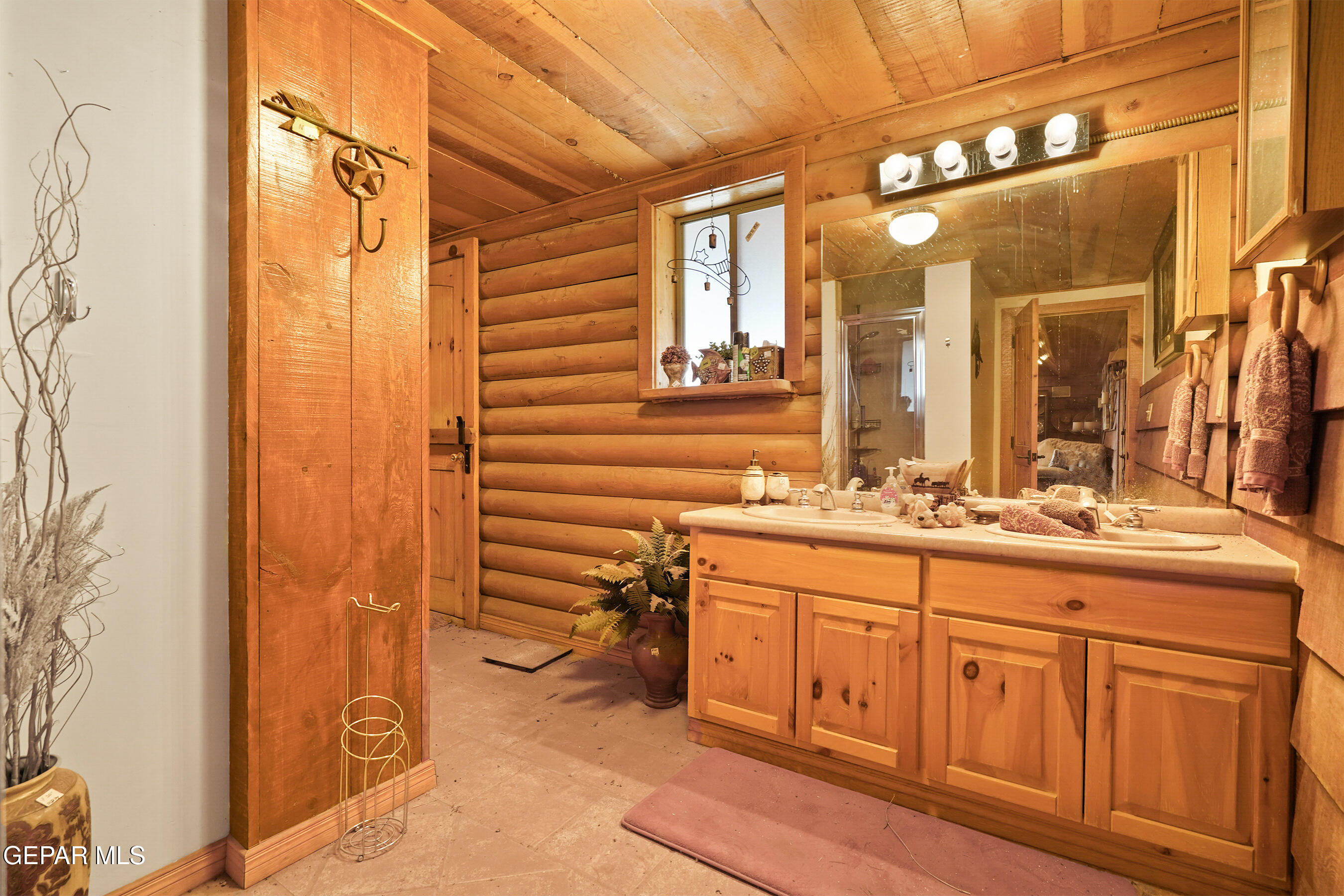1100 Vinton Road Anthony, TX 79821 - Photo 28 of 83 a bathroom with a granite countertop sink a mirror and a shower