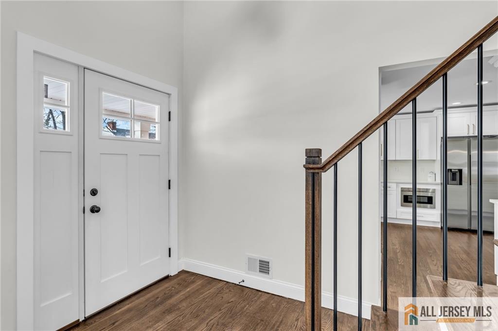27 Sheppard Place Edison, NJ 08817 - Photo 20 of 75 a view of an entryway with wooden floor