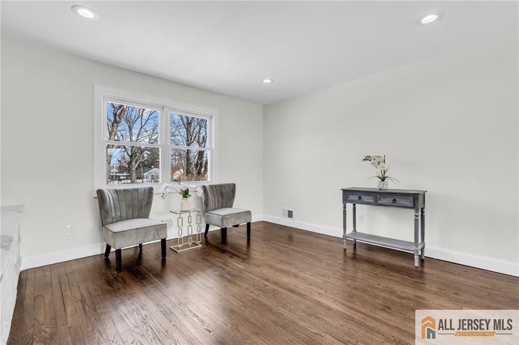 27 Sheppard Place Edison, NJ 08817 - Photo 30 of 75 a living room with furniture and a wooden floor