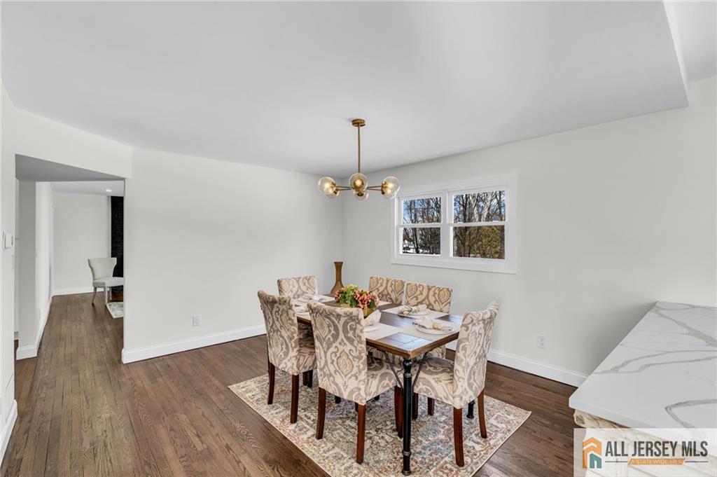 27 Sheppard Place Edison, NJ 08817 - Photo 32 of 75 a view of a dining room with a table and chairs