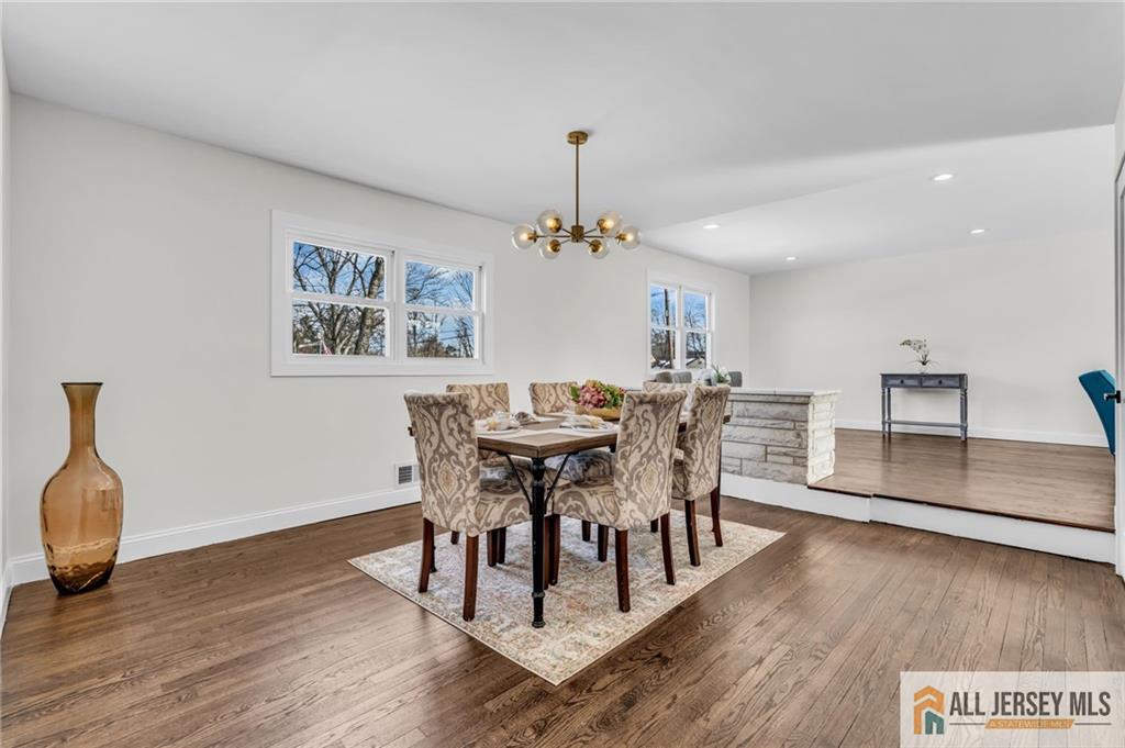 27 Sheppard Place Edison, NJ 08817 - Photo 34 of 75 a view of a dining room with furniture and wooden floor