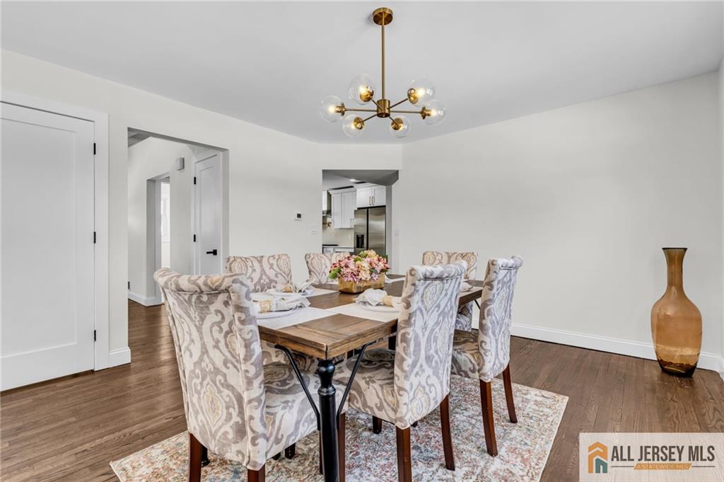 27 Sheppard Place Edison, NJ 08817 - Photo 35 of 75 a view of a dining room with furniture wooden floor and chandelier