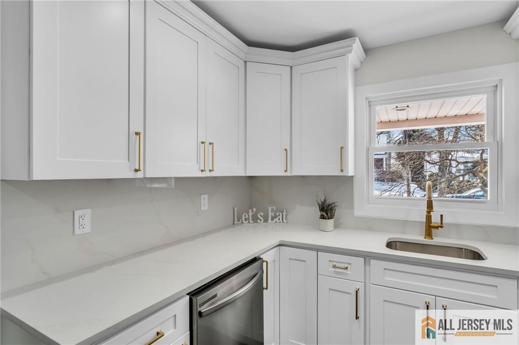 27 Sheppard Place Edison, NJ 08817 - Photo 57 of 75 a kitchen with appliances cabinets and a sink