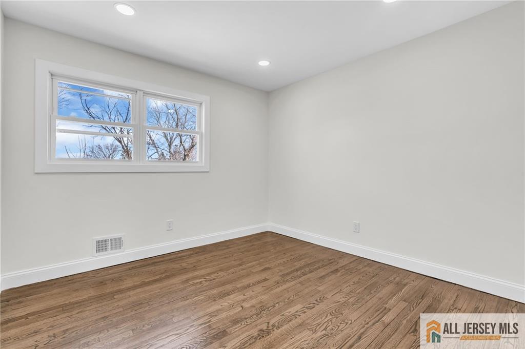 27 Sheppard Place Edison, NJ 08817 - Photo 61 of 75 a view of wall with window and wooden floor