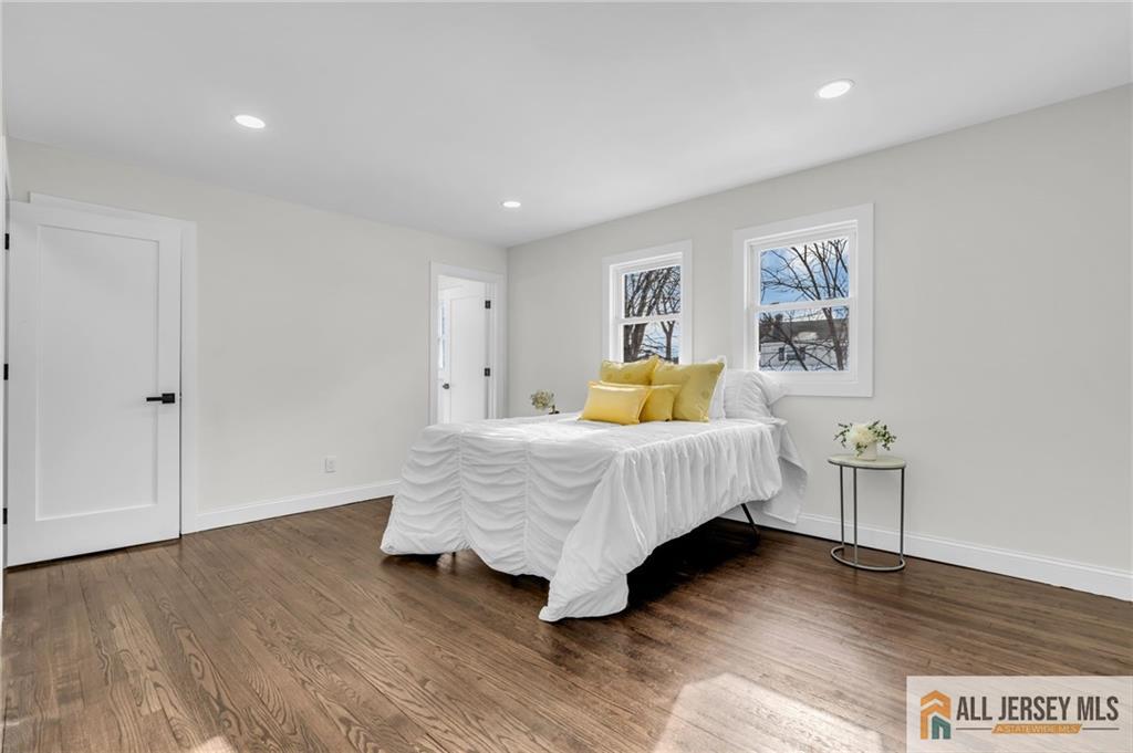 27 Sheppard Place Edison, NJ 08817 - Photo 65 of 75 a bedroom with a bed and wooden floor