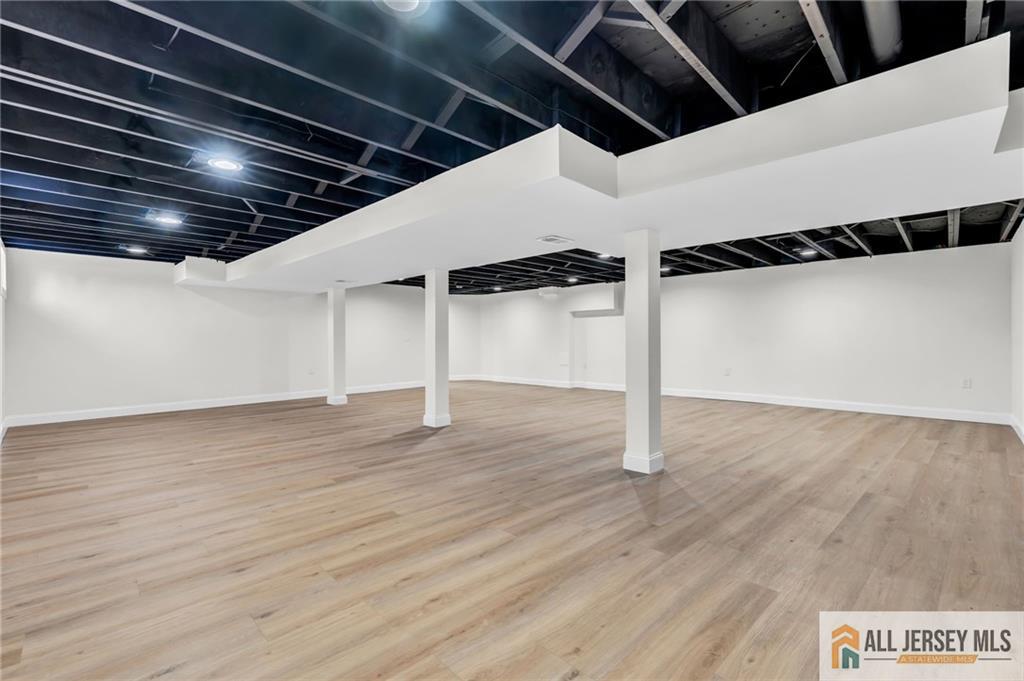 27 Sheppard Place Edison, NJ 08817 - Photo 69 of 75 a view of a room with wooden floor