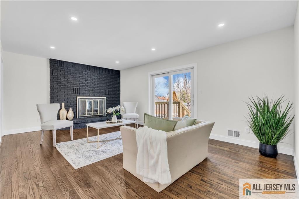 27 Sheppard Place Edison, NJ 08817 - Photo 73 of 75 a living room with furniture a potted plant and a table