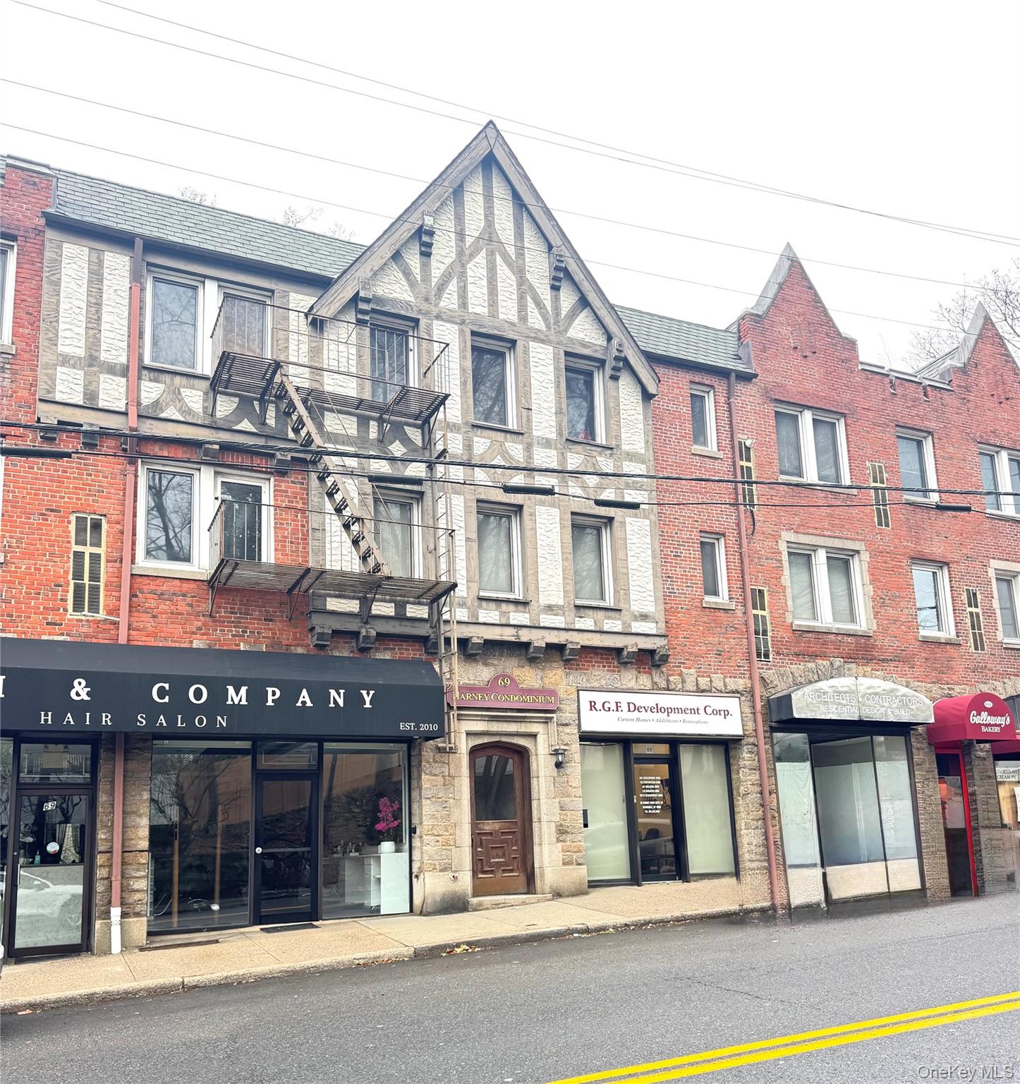 a front view of a brick building with many windows