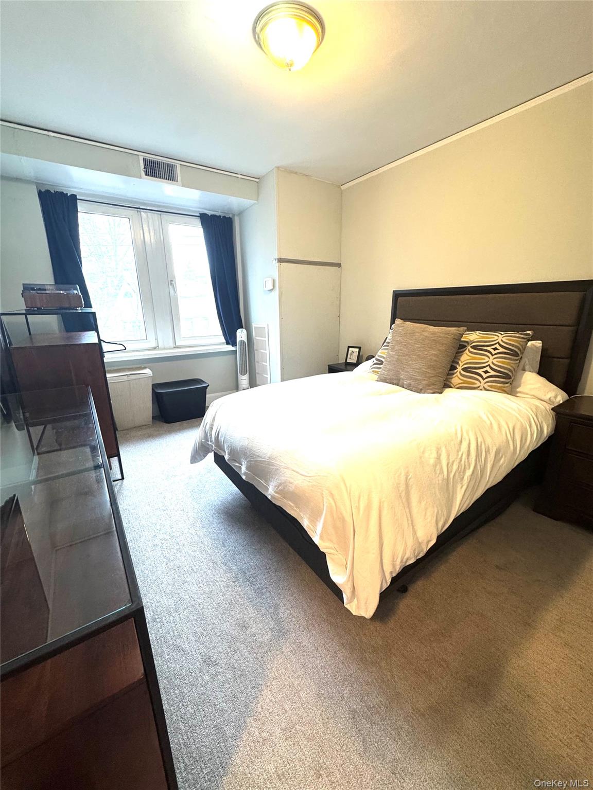 69 Harney Road, Unit 5B Scarsdale, NY 10583 - Photo 13 of 17 a bedroom with a bed and window