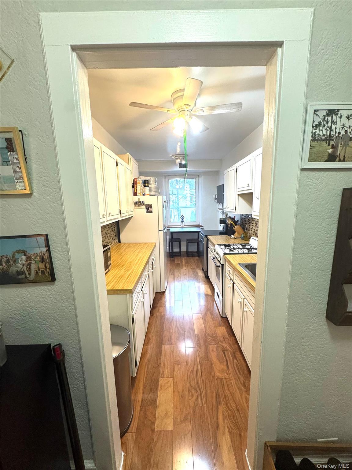 69 Harney Road, Unit 5B Scarsdale, NY 10583 - Photo 3 of 17 a view of a kitchen from the hallway