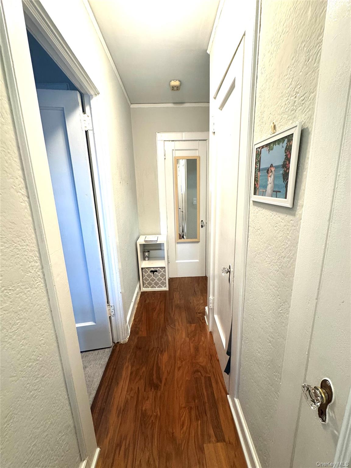 69 Harney Road, Unit 5B Scarsdale, NY 10583 - Photo 6 of 17 a view of a hallway with wooden floor and staircase