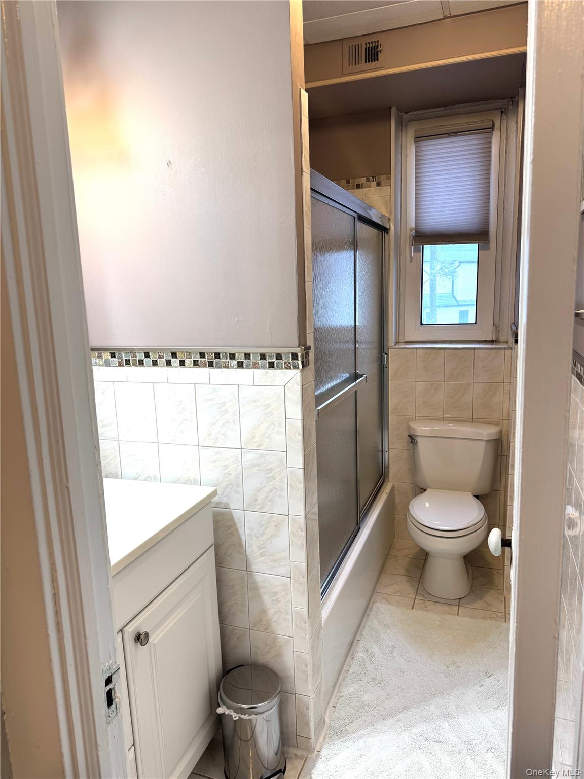 69 Harney Road, Unit 5B Scarsdale, NY 10583 - Photo 10 of 17 a bathroom with a toilet and a shower