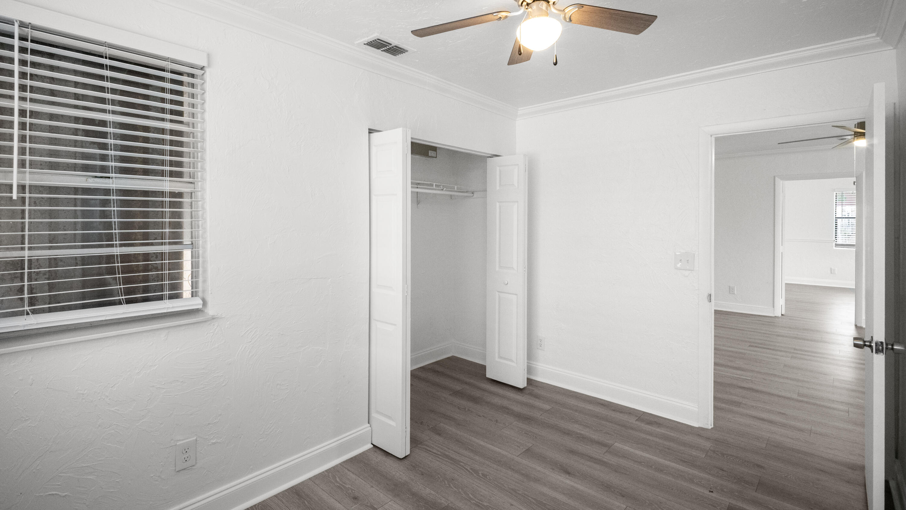 1233 West 32nd Street Riviera Beach, FL 33404 - Photo 21 of 25 wooden floor in an empty room