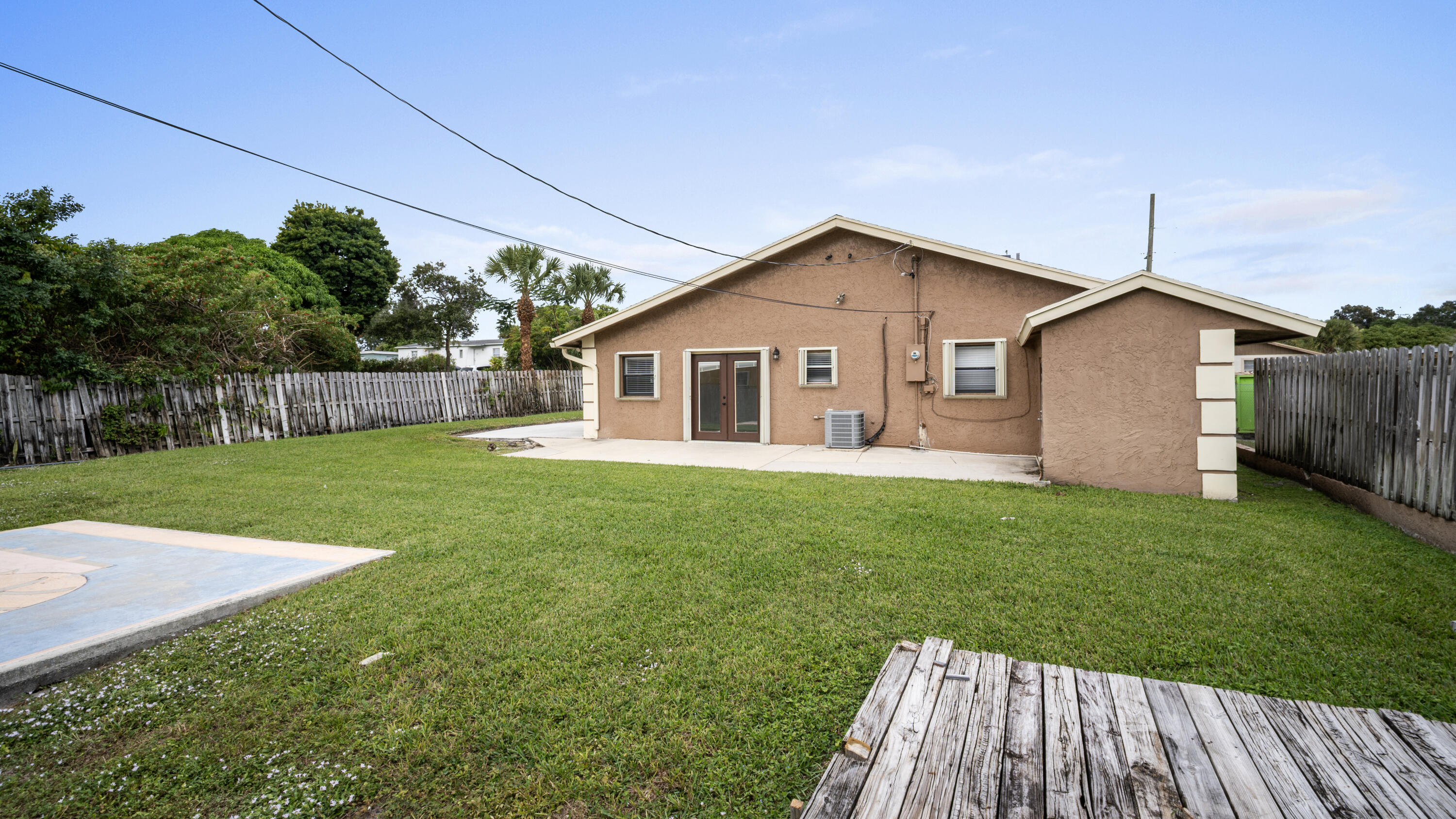 1233 West 32nd Street Riviera Beach, FL 33404 - Photo 25 of 25 a view of a house with a yard
