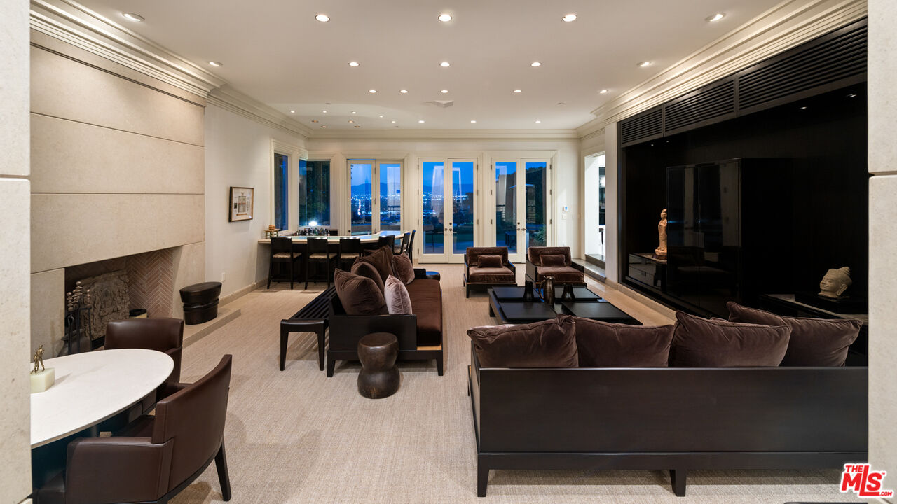 14035 Aubrey Road Beverly Hills, CA 90210 - Photo 12 of 24 a room with gym equipment and a large window