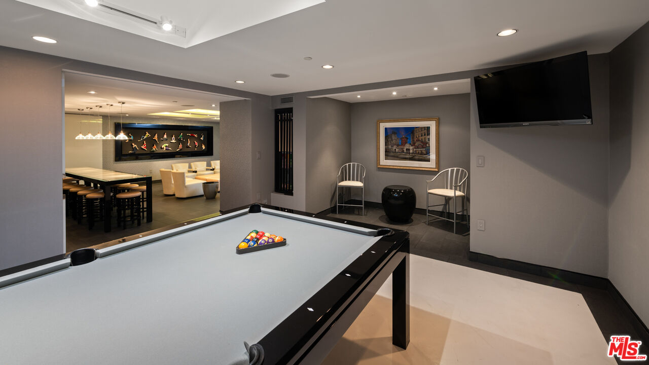 14035 Aubrey Road Beverly Hills, CA 90210 - Photo 14 of 24 a living room with furniture and a flat screen tv