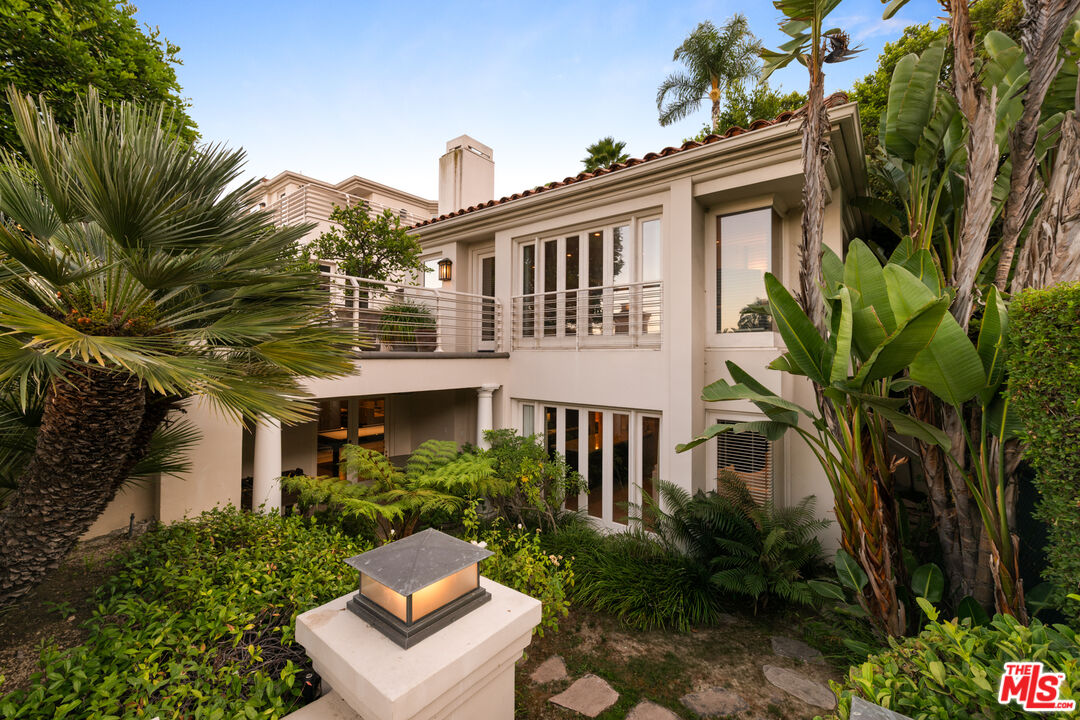 14035 Aubrey Road Beverly Hills, CA 90210 - Photo 17 of 24 a view of a house with a flower garden