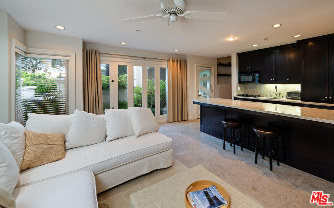 14035 Aubrey Road Beverly Hills, CA 90210 - Photo 18 of 24 a living room with furniture and a large window