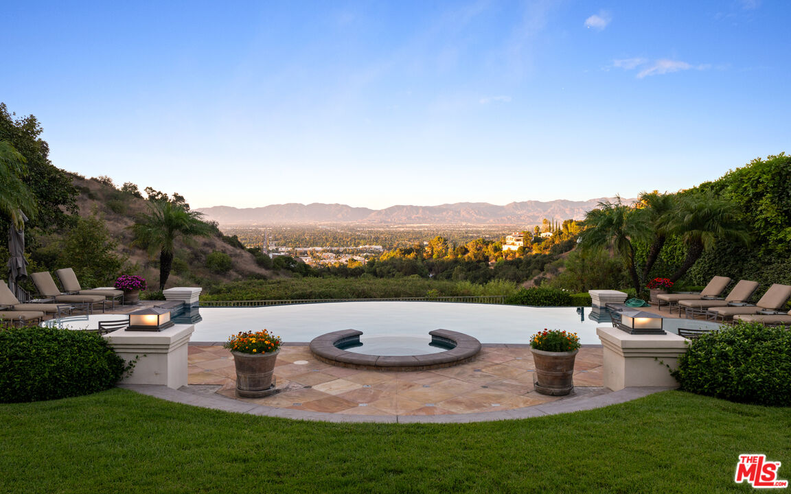 14035 Aubrey Road Beverly Hills, CA 90210 - Photo 4 of 24 a view of a house with backyard sitting area and swimming pool