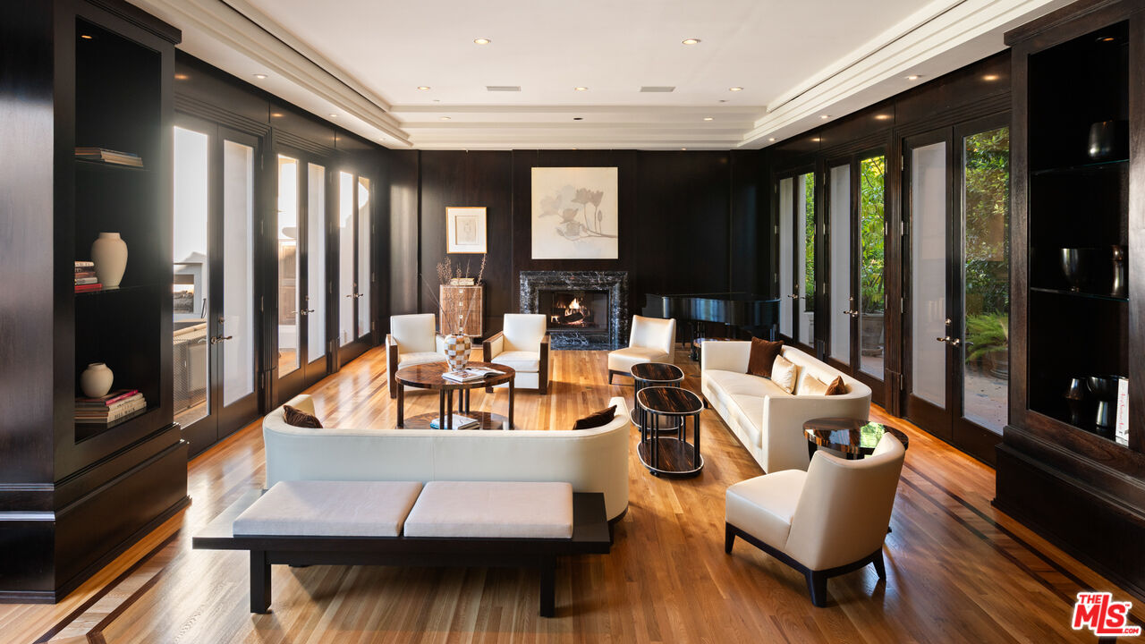 14035 Aubrey Road Beverly Hills, CA 90210 - Photo 7 of 24 a living room with furniture and large windows