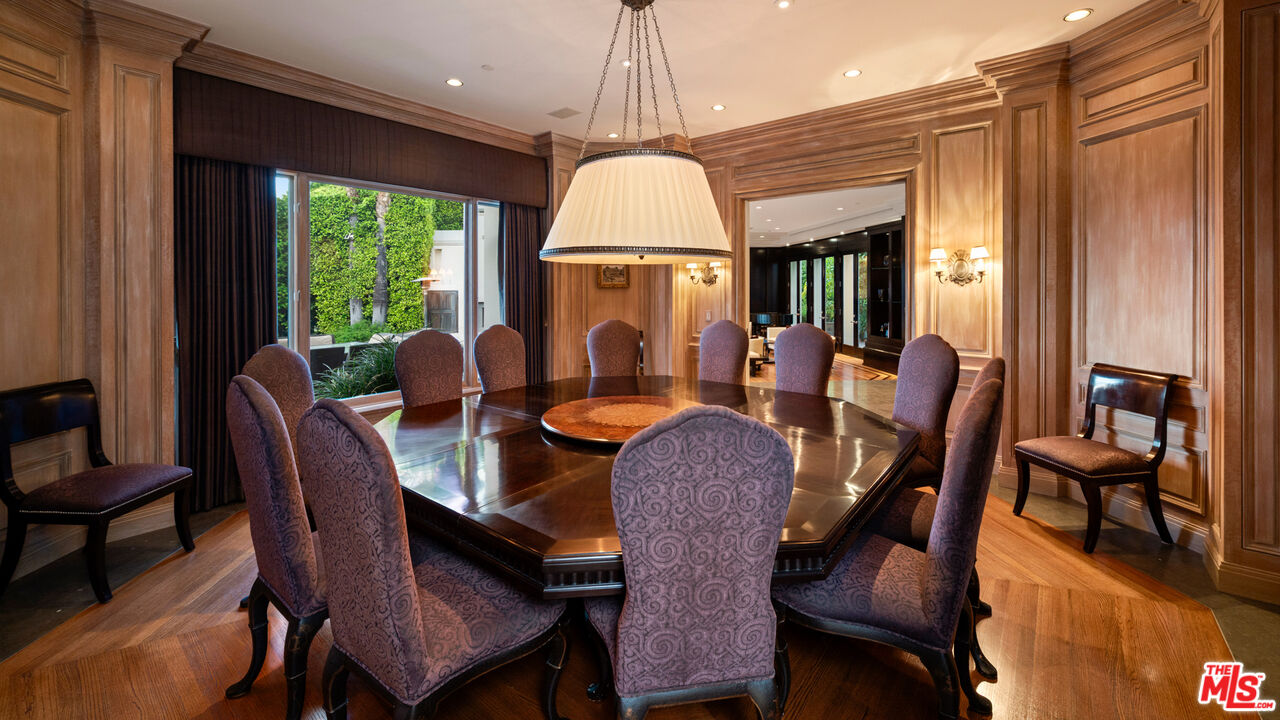 14035 Aubrey Road Beverly Hills, CA 90210 - Photo 8 of 24 a dining room with furniture a chandelier and wooden floor