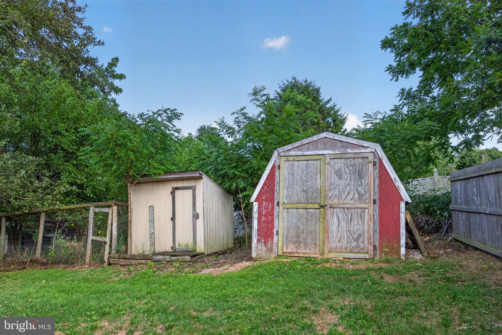 2634 Pleasant Hill Road Hanover, PA 17331 - Photo 16 of 52 Charming sheds nestled in greenery.