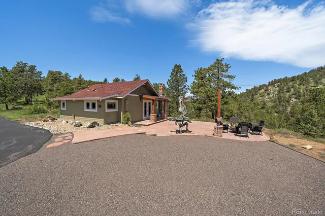 a kitchen with a table and chairs in it