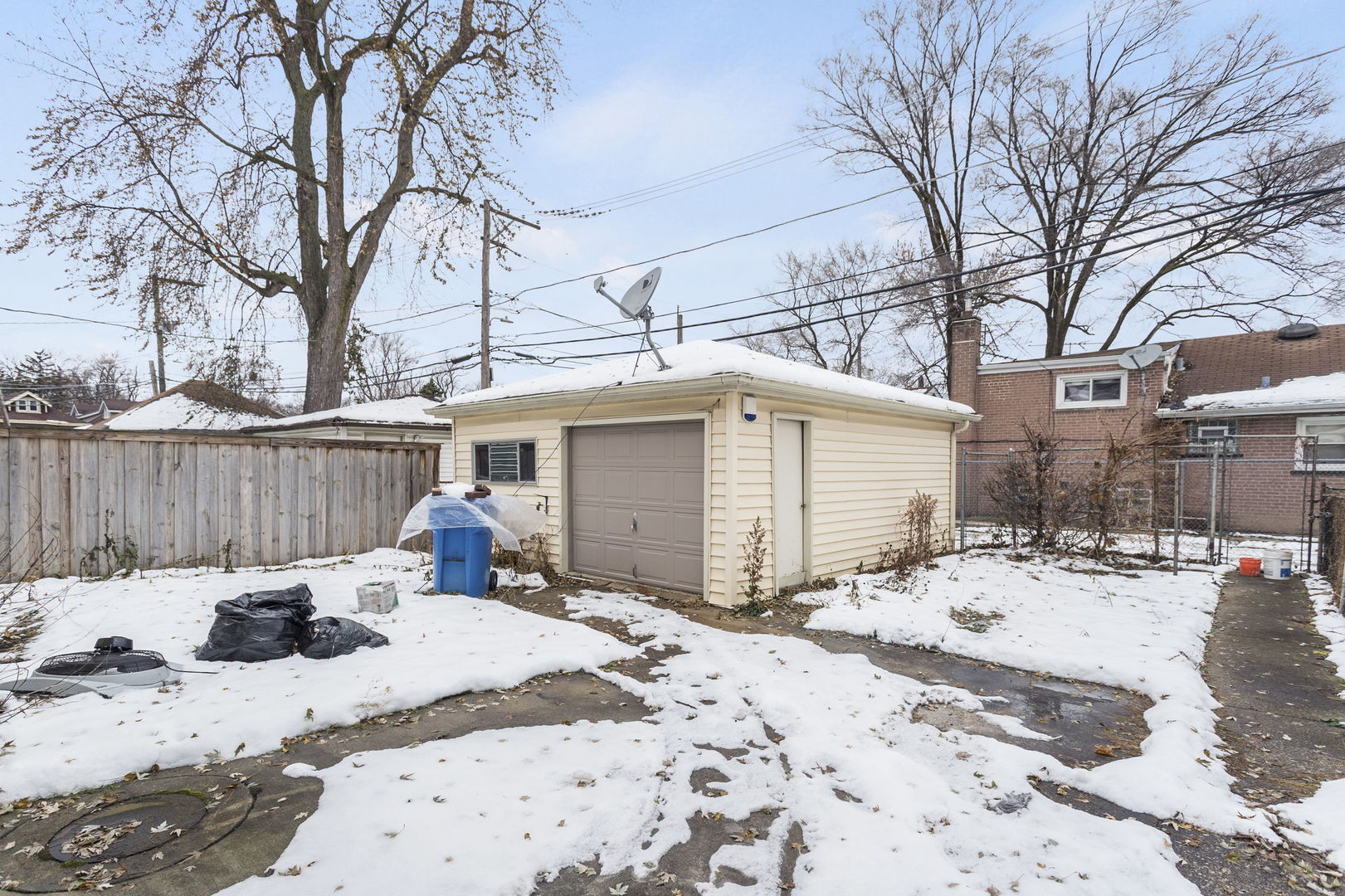 1404 West 97th Street Chicago, IL 60643 - Photo 13 of 13 a view of a backyard with snow on the road