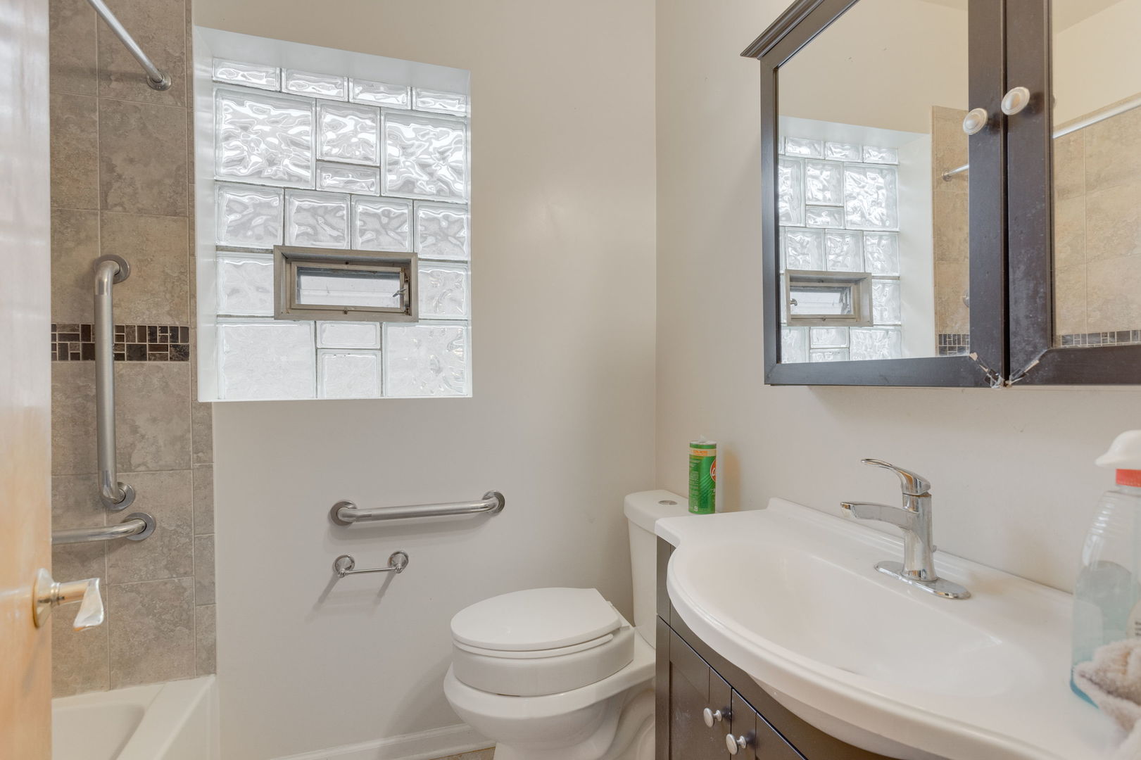 1404 West 97th Street Chicago, IL 60643 - Photo 7 of 13 a bathroom with a sink toilet and shower
