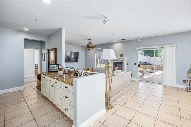 a large white kitchen with cabinets