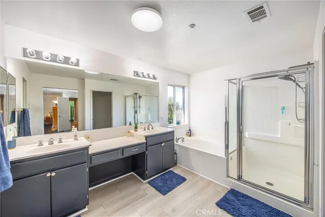 a bathroom with a sink vanity mirror and toilet