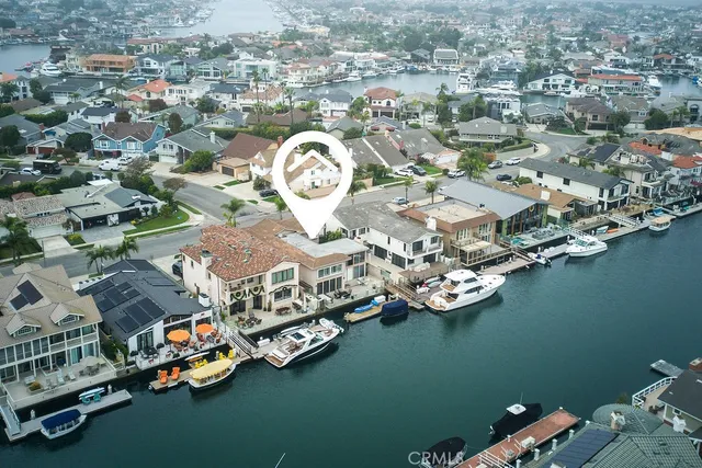 an aerial view of a house with a lake view