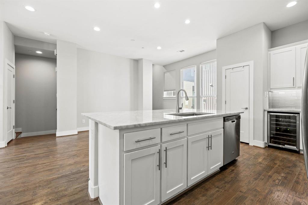 4690 Monarch Street, Unit 20 Dallas, TX 75204 - Photo 7 of 26 a spacious bathroom with a granite countertop sink and a mirror