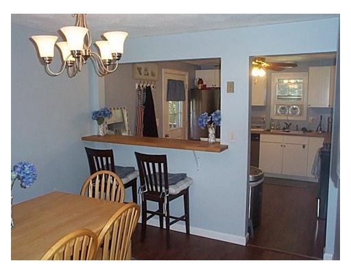 14 Robin Drive Exeter, RI 02822 - Photo 3 of 11 Dining Room. The view into the kitchen from the dining room, note updated appliances in kitchen and crisp clean interior.