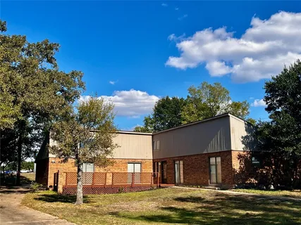 a front view of a house with a door and wooden floor