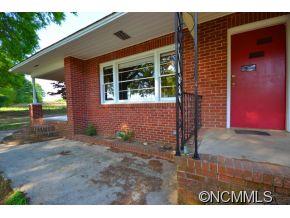 1422 Prince Road Columbus, NC 28722 - Photo 2 of 24 a front view of a house with a yard