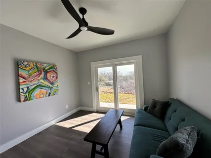 a living room with furniture and a window