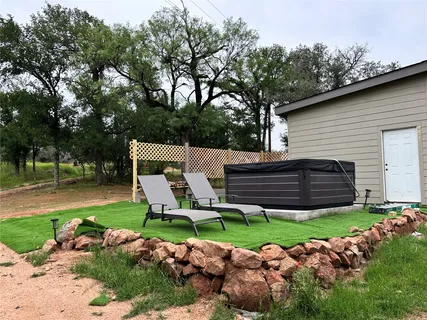 a view of backyard with a garden and entertaining space