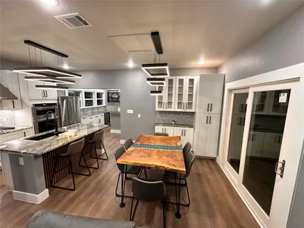 a view of a dining room with furniture window and wooden floor