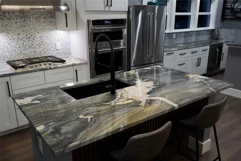 a kitchen with a table chairs and a stove