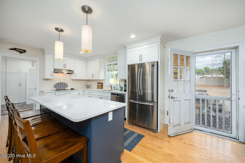 409 Windemere Road Wilmington, NC 28405 - Photo 23 of 54 Kitchen with Door Out to Patio and outdoor living space