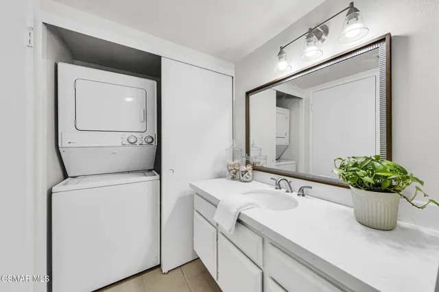 a view of a porch with furniture and a yard