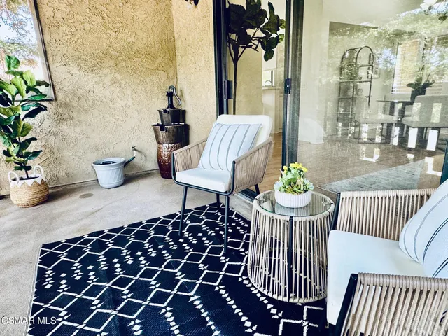 a view of a house with backyard and deck